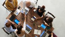 Business people shaking hands at a table