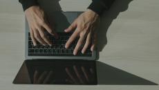 Person typing on a laptop