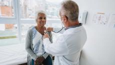 Doctor listening to a patients heart with a stethoscope