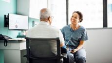 A doctor talking with a patient.