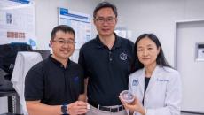 Representatives from NTU Singapore, Procter & Gamble, and Agency for Science, Technology and Research pose side-by-side while showing the HapSense ring-type device for skincare cosmetic product analysis.