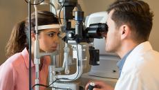 patient eye exam with doctor