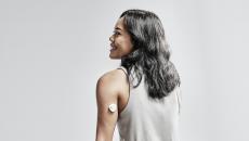 A model wearing the Nutromics lab-on-a-patch continuous monitoring device