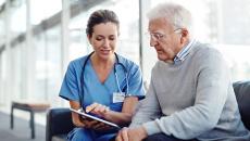 Provider gives options to patient while looking at a tablet or notepad