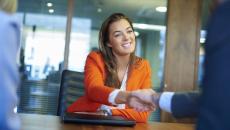 A person shaking hands during an interview