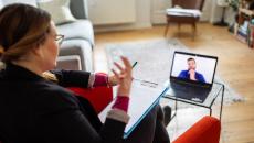 Person talking to someone over computer