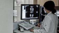 A radiologist assessing a mammogram using the Lunit INSIGHT MMG