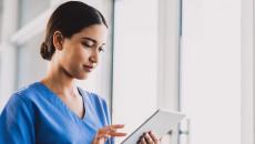 A nurse using a tablet