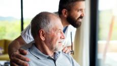 A man at home with a caregiver