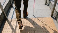 A person walking with cane