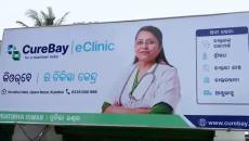 A signboard of a CureBay e-clinic in rural India