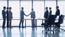 Business people shaking hands in a meeting