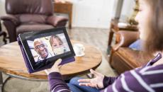 A young woman receiving healthcare through video call