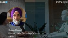 Updesh Dosanjh at IQVIA_ Person typing with animated chatbot AI by sakdam/Vetta/Getty Images