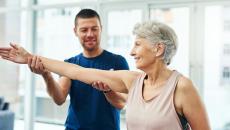 A physiotherapist working with a senior patient