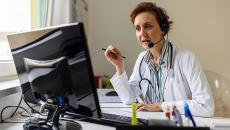 A doctor in a teleconsultation with a patient